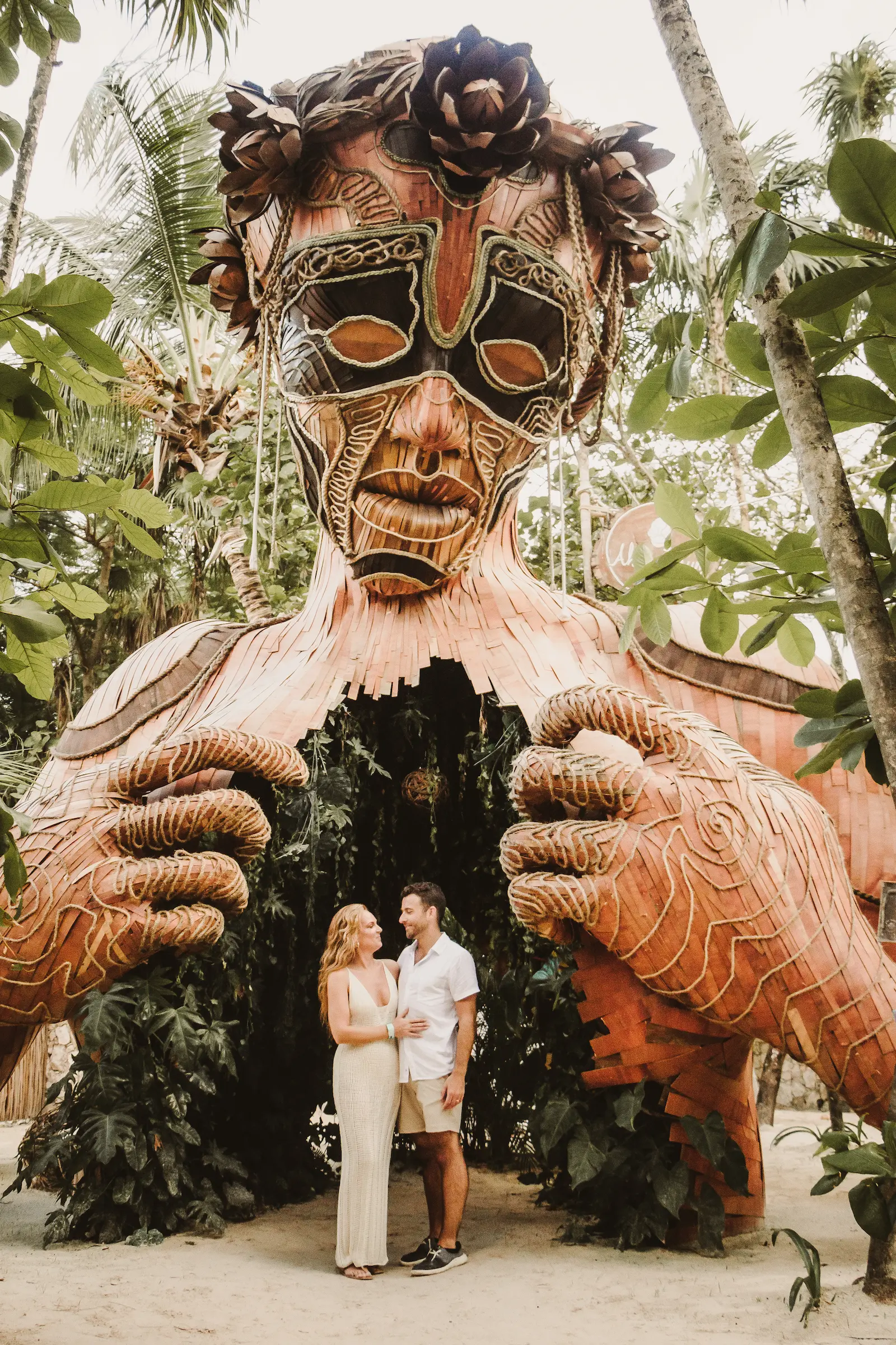 Romantic couple walking hand in hand on Tulum beach at sunset captured naturally