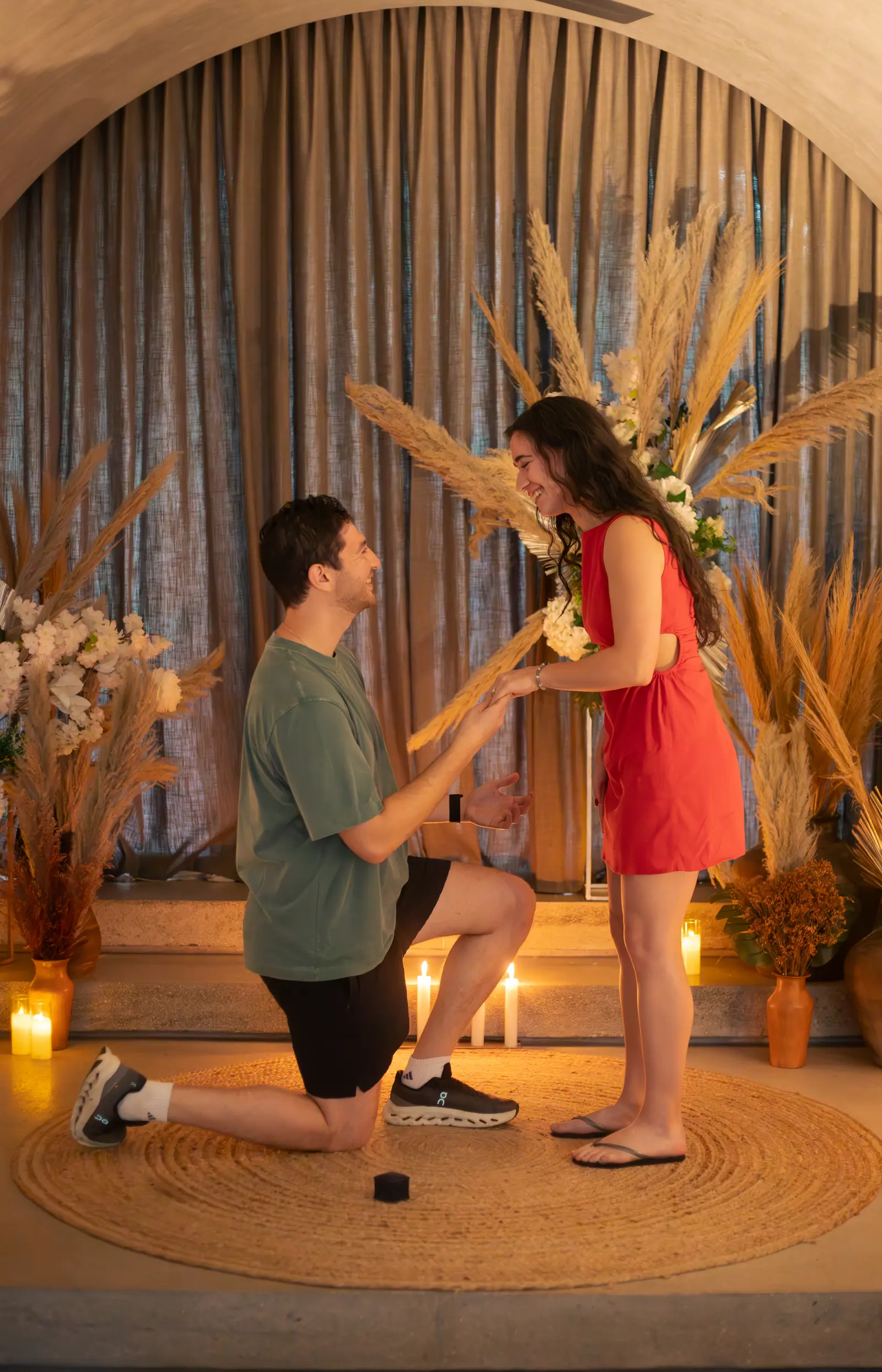 Romantic kneeling proposal on sandy Tulum beach photographed at golden hour naturally
