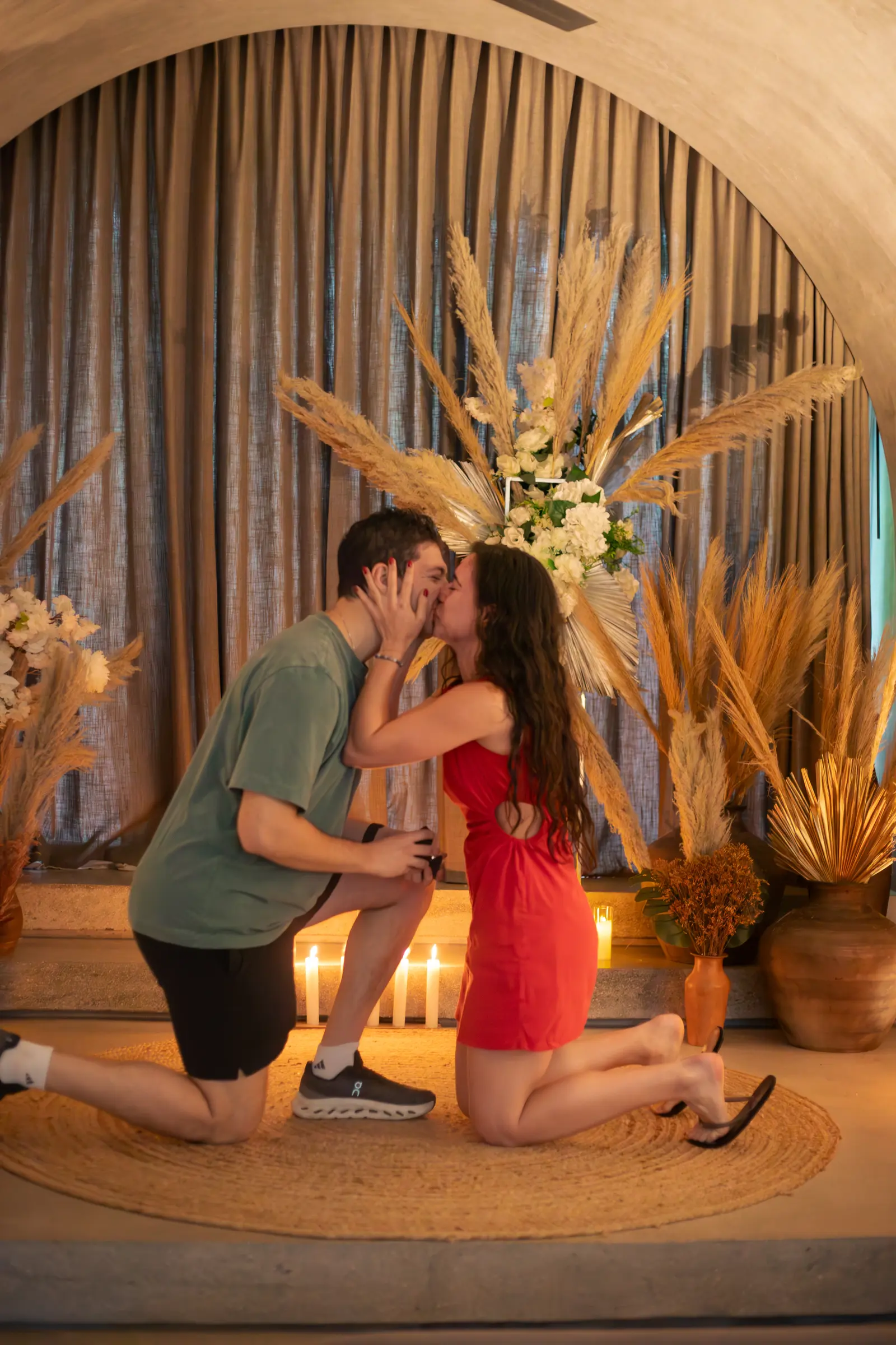 Surprise proposal captured with warm Tulum light and emotional reaction moment