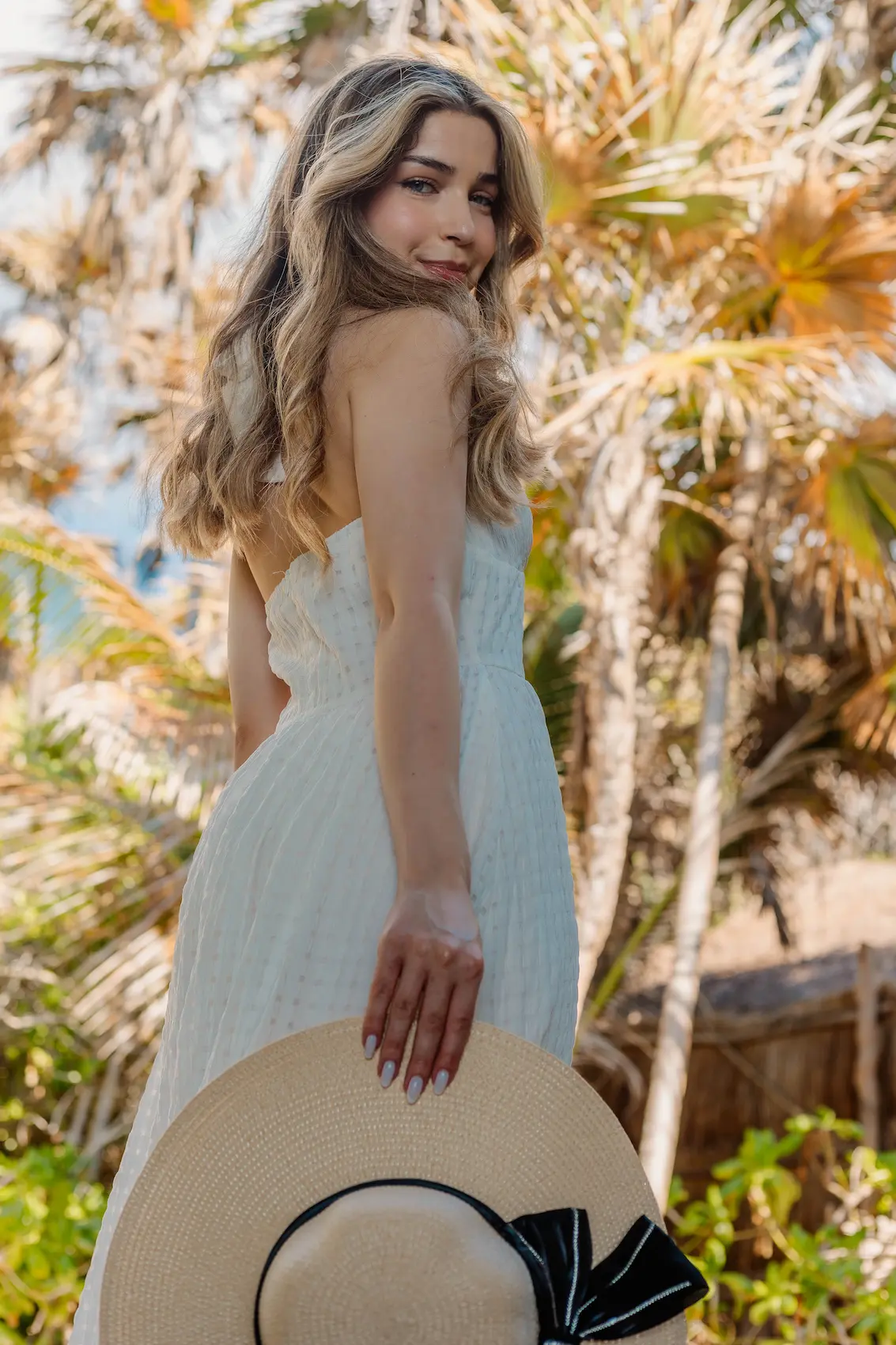 Artistic jungle portrait of solo traveler during professional photoshoot in Tulum