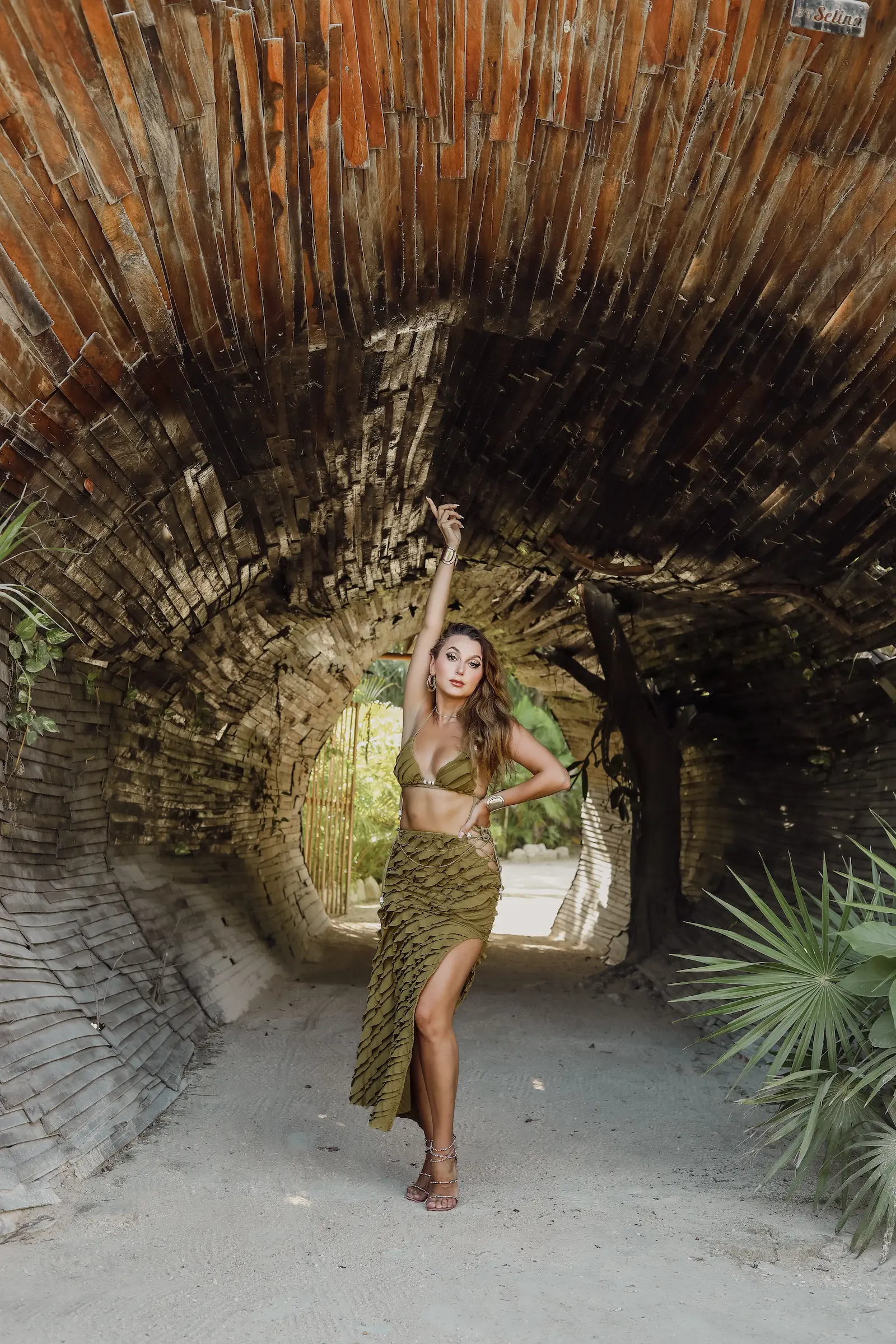 Soft pastel lifestyle photoshoot on Tulum beach featuring flowing dress at golden hour